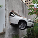 Illustration for article titled This BMW X1 Crashed Through A Parking Garage Wall In Brazil